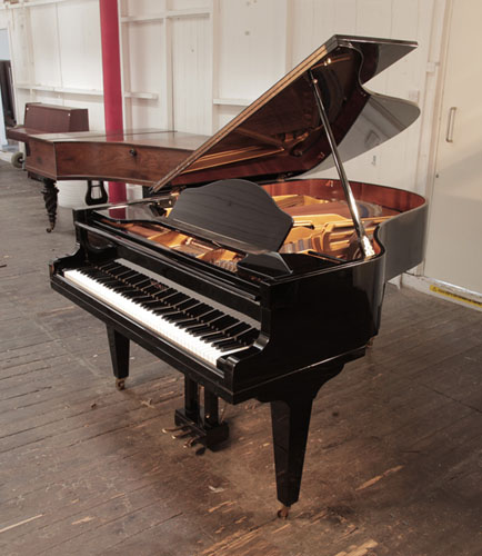 Reconditioned, 2000, Welmar grand piano for sale in black gloss. Piano has an eighty-eight note keyboard and a three-pedal lyre. 